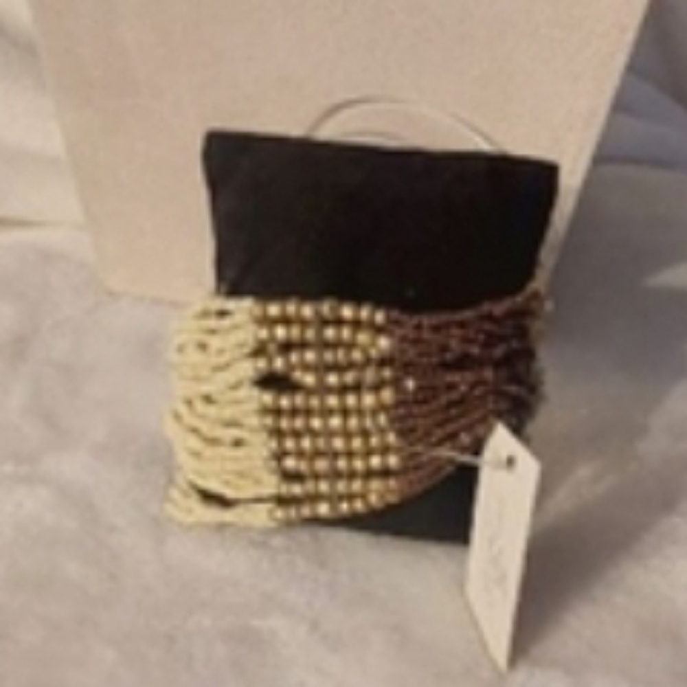 Beaded Brown and Beige stretchy bracelet.